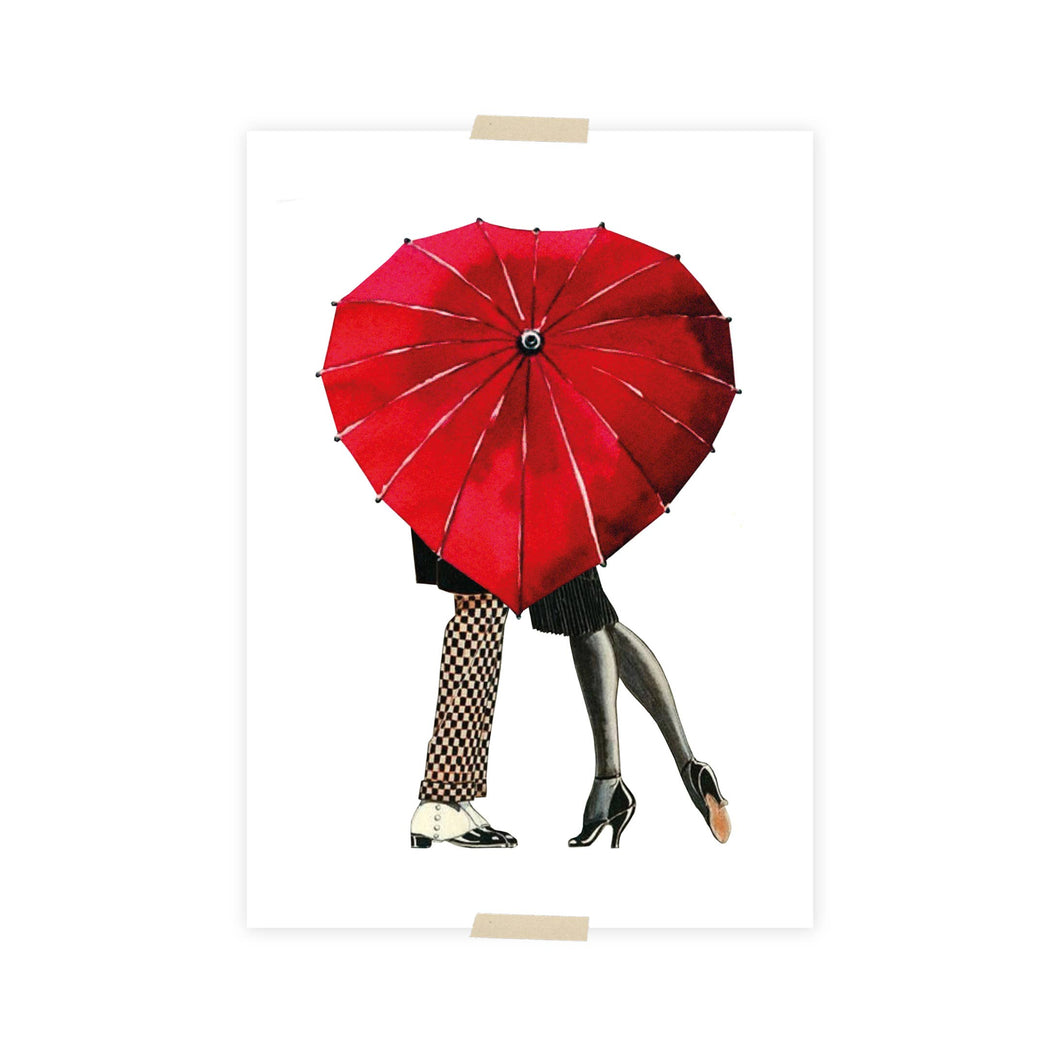 Postcard collage set behind umbrella